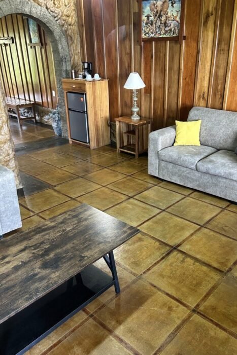 Spacious living area," "Main Room cabin," and "rustic wood." This is what travelers visualize when thinking of a cabin getaway.